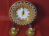 Wall clock and candlestick